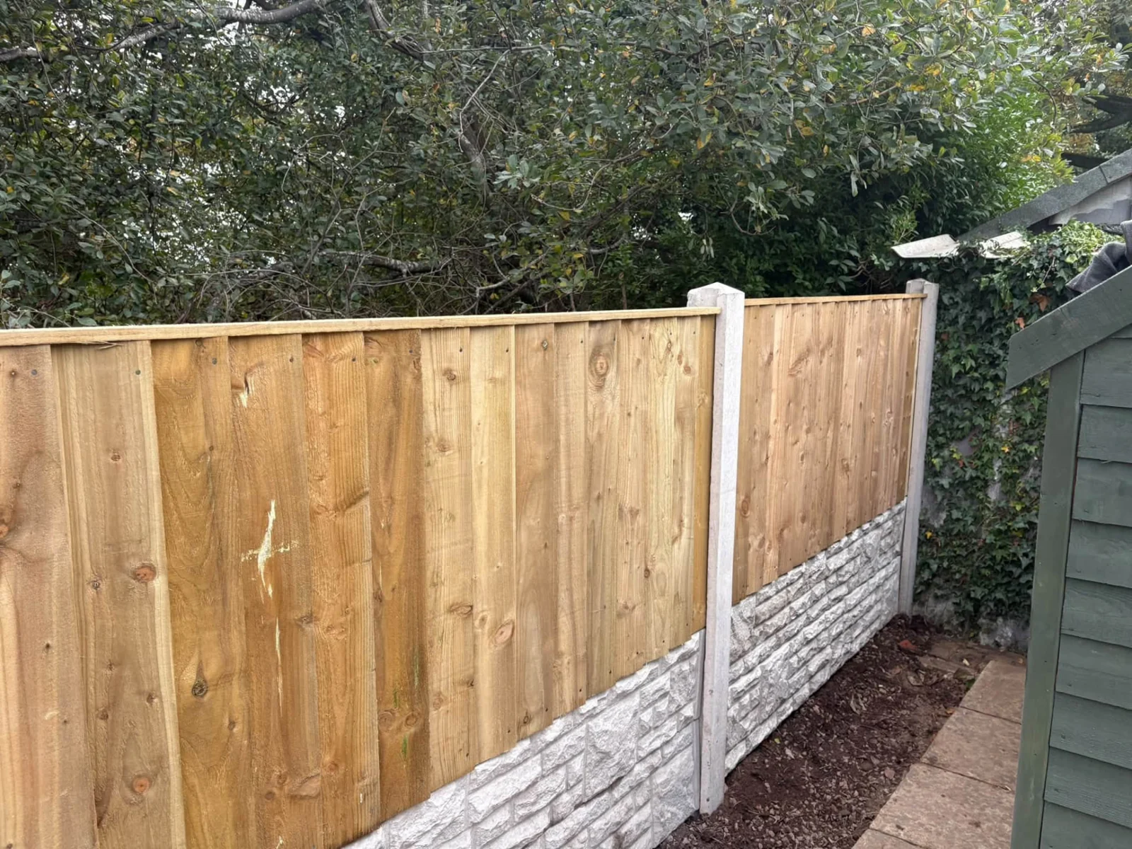New timber garden fencing with concrete posts and decorative gravel boards